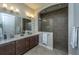 Modern bathroom with double sink vanity and a glass-enclosed tiled shower at 1545 Calaveras Cir, Mount Pleasant, SC 29466