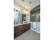 Elegant bathroom with double sinks, a large mirror, and tiled shower at 1545 Calaveras Cir, Mount Pleasant, SC 29466