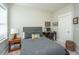 Cozy bedroom featuring a gray bed, wooden nightstand, and a computer desk, perfect for relaxation and work at 1545 Calaveras Cir, Mount Pleasant, SC 29466