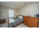 Comfortable bedroom features a gray bed, dresser with a model airplane, and plenty of natural light at 1545 Calaveras Cir, Mount Pleasant, SC 29466