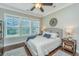 Cozy bedroom with large window, ceiling fan, and stylish decor at 1545 Calaveras Cir, Mount Pleasant, SC 29466