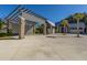 Community covered parking area with palm trees and a well-maintained driveway at 1545 Calaveras Cir, Mount Pleasant, SC 29466
