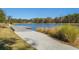 Walking path to community dock over the lake provides ample space for recreational enjoyment at 1545 Calaveras Cir, Mount Pleasant, SC 29466