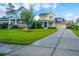 Inviting home exterior with manicured lawn and mature trees, offering great curb appeal at 1545 Calaveras Cir, Mount Pleasant, SC 29466