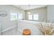 Well-lit hallway with white trim, gray walls, and neutral carpeting at 1545 Calaveras Cir, Mount Pleasant, SC 29466