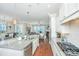 Bright kitchen with white cabinets, granite counters, and stainless appliances that opens to living areas at 1545 Calaveras Cir, Mount Pleasant, SC 29466