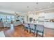 Open kitchen with island seating, granite countertops, stainless steel appliances, and seamless flow to the living room at 1545 Calaveras Cir, Mount Pleasant, SC 29466