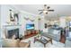 Inviting living room with a cozy fireplace, TV, and hardwood floors, creating a warm atmosphere at 1545 Calaveras Cir, Mount Pleasant, SC 29466