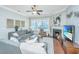 Comfortable living room featuring a fireplace, modern furnishings, and a ceiling fan at 1545 Calaveras Cir, Mount Pleasant, SC 29466
