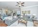 Open-concept living room showcasing stylish sofas, a coffee table, and seamless flow to other living spaces at 1545 Calaveras Cir, Mount Pleasant, SC 29466