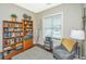 Cozy home office with a large window, bookshelves, and comfortable seating, providing an ideal workspace at 1545 Calaveras Cir, Mount Pleasant, SC 29466