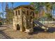 Wooden playground structure with slides and climbing features, offering a fun and safe play area at 1545 Calaveras Cir, Mount Pleasant, SC 29466
