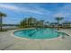 A large, inviting community pool surrounded by lush landscaping and beautiful homes at 1545 Calaveras Cir, Mount Pleasant, SC 29466