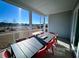 Covered porch with outdoor dining set overlooking a scenic landscape at 1575 Trailmore Ln, Summerville, SC 29486