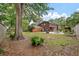 Expansive backyard featuring a patio with a dining set, seating, fire pit, and a well-maintained lawn, perfect for outdoor entertaining at 1603 Culpepper Cir, Charleston, SC 29407