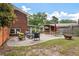 Backyard patio features comfortable seating, dining set, and grill, offering an inviting space for outdoor gatherings and relaxation at 1603 Culpepper Cir, Charleston, SC 29407