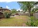 Spacious backyard with lush greenery, an outdoor seating area, and a fire pit, perfect for outdoor entertaining at 1603 Culpepper Cir, Charleston, SC 29407