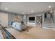 Finished basement featuring neutral tones, entertainment center, and staircase access to the upper level at 1603 Culpepper Cir, Charleston, SC 29407