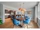 Elegant dining room with stylish lighting, a modern dining table, and easy access to the kitchen area at 1603 Culpepper Cir, Charleston, SC 29407