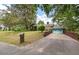 View of a home's brick driveway leading to a light-blue garage door at 1603 Culpepper Cir, Charleston, SC 29407