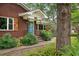 Close up on the red brick home's front porch and bright blue door at 1603 Culpepper Cir, Charleston, SC 29407
