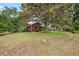 Charming brick home with a well-manicured front yard and mature trees, offering curb appeal and a welcoming atmosphere at 1603 Culpepper Cir, Charleston, SC 29407