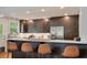 Charming kitchen featuring a breakfast bar, stainless steel appliances, custom cabinetry, and backyard views at 1603 Culpepper Cir, Charleston, SC 29407