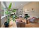 Spacious living room with light brick fireplace and an array of plants at 1603 Culpepper Cir, Charleston, SC 29407