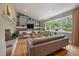 Living room with hardwood floors, custom shelving, and cozy seating arrangement at 1603 Culpepper Cir, Charleston, SC 29407