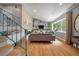 Bright living room featuring custom built-in shelving and hardwood flooring at 1603 Culpepper Cir, Charleston, SC 29407