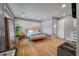 Bright main bedroom with light wood floors, a calming mural, and modern decor at 1603 Culpepper Cir, Charleston, SC 29407