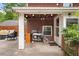 Back patio with string lights, a grill, and cozy seating offers a perfect space for relaxation and outdoor cooking at 1603 Culpepper Cir, Charleston, SC 29407