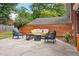 Backyard patio with an outdoor seating area, perfect for relaxation and entertaining with a stylish privacy fence at 1603 Culpepper Cir, Charleston, SC 29407