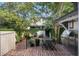 Outdoor brick patio with stainless steel grill and space for dining and entertaining at 166 1/2 Queen St, Charleston, SC 29401