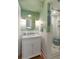 Elegant bathroom featuring a marble vanity and a glass-enclosed shower with white subway tiles at 166 1/2 Queen St, Charleston, SC 29401