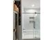 Stylish bathroom featuring a shower over tub and floral wallpaper at 166 1/2 Queen St, Charleston, SC 29401