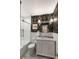Stylish bathroom featuring a shower over tub and floral wallpaper at 166 1/2 Queen St, Charleston, SC 29401
