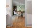 Cozy dining area with round table, patterned wallpaper, and built in seating at 166 1/2 Queen St, Charleston, SC 29401