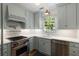 Stylish kitchen featuring stainless steel appliances, modern countertops and ample storage space at 166 1/2 Queen St, Charleston, SC 29401
