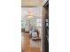 Bright main bedroom featuring hardwood floors, white furniture, and a unique ceiling fan at 166 1/2 Queen St, Charleston, SC 29401