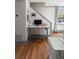 Bright home office with desk, computer, and hardwood flooring at 166 1/2 Queen St, Charleston, SC 29401