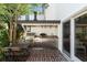 Outdoor kitchen with stainless steel grill, sink, counter space, and brick-paved patio at 166 1/2 Queen St, Charleston, SC 29401
