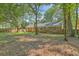 Spacious backyard featuring mature trees, creating a serene and private outdoor setting at 169 Southwold Cir, Goose Creek, SC 29445
