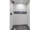 Shower stall with a herringbone tile pattern and black fixtures, with a recessed niche at 169 Southwold Cir, Goose Creek, SC 29445