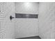 Shower stall with a herringbone tile pattern and black fixtures, with a recessed niche at 169 Southwold Cir, Goose Creek, SC 29445