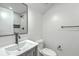 Bathroom featuring white walls, black hardware, a toilet, and a shower visible in the mirror at 169 Southwold Cir, Goose Creek, SC 29445