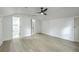 Bedroom with luxury vinyl plank flooring leading to ensuite bathroom and walk-in closet at 169 Southwold Cir, Goose Creek, SC 29445