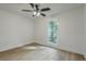 This bedroom has a ceiling fan and large window at 169 Southwold Cir, Goose Creek, SC 29445
