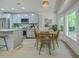 Cozy dining area next to the kitchen with backyard views and contemporary wicker chairs at 169 Southwold Cir, Goose Creek, SC 29445