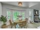 Bright dining nook with large windows, a round table, and views of the private yard at 169 Southwold Cir, Goose Creek, SC 29445